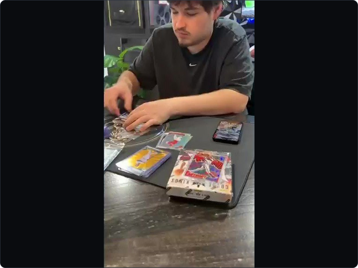 Connor at the studio table, with the cards he spent years learning about.